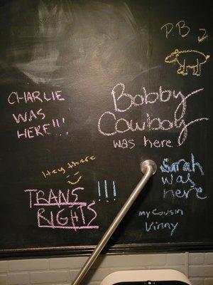 Leave your mark on our chalkboard walls in the unisex bathrooms.