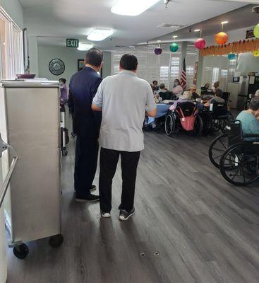 Administrator Ray checking on the lunch served in the dining room.