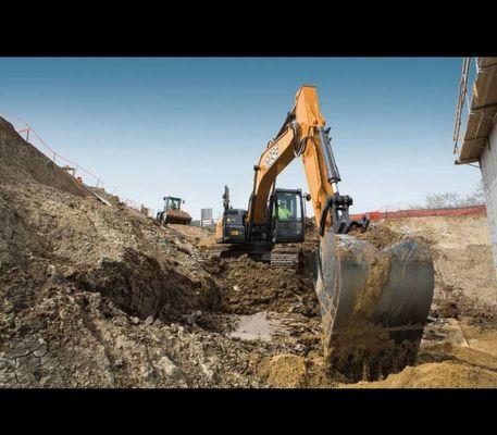 Case excavator in action killing covid and building houses