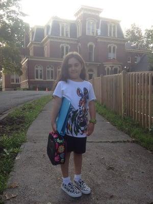 A child arriving to the beautiful Waldorf school.