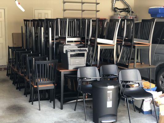 Chairs packed into a garage