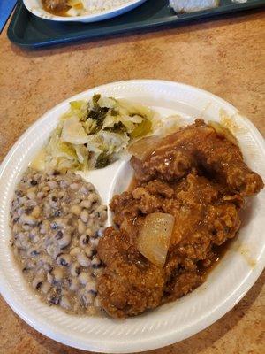 Smothered fried chicken,cabbage and black-eyed peas