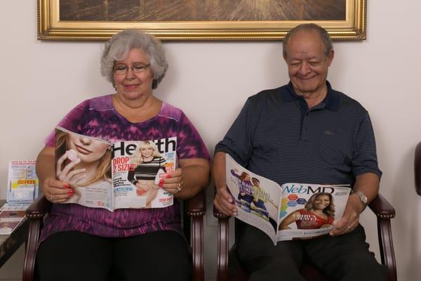 These patients are enjoying our reading material while they wait for their checkups.