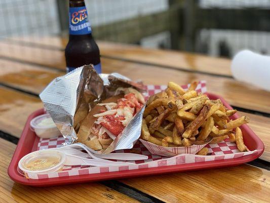 Lobster roll with small fries and blueberry soda