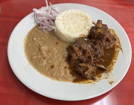 Seco de Cabrito (goat stew with rice and beans)