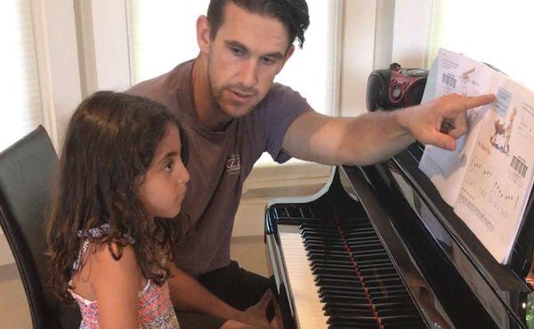 Teaching Lea piano at her home