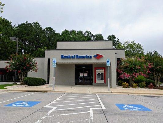 Outside. Storefront. 1.0x zoom. There is one walk-up ATM and one drive-thru ATM.