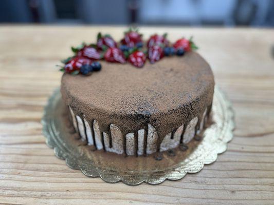 mixed berry cake topped with chocolate