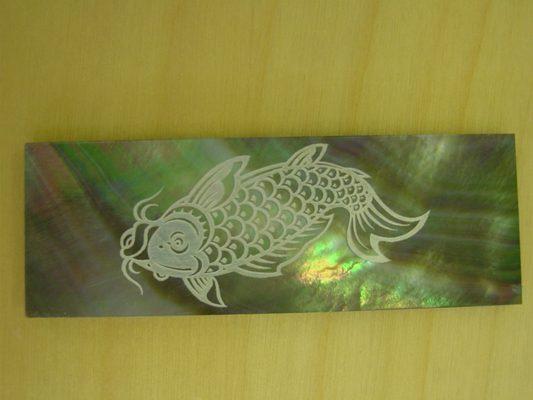 Laser engraved Abalone Shell.