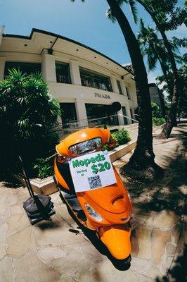 One of our display mopeds at one of our convenient pickup locations in Waikiki!