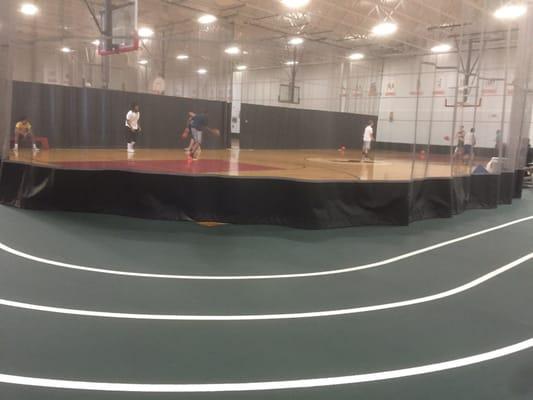 Running track around 3 basketball courts