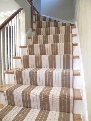 Landry & Arcari stair runner.  The stripe pattern is installed smartly at the turn landing to match the straight runner.