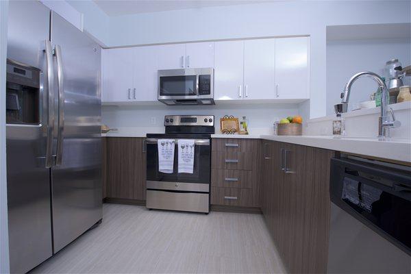 Quartz countertops and two-toned cabinetry