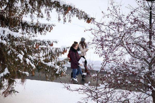 Students walking to school after a heavy snow.