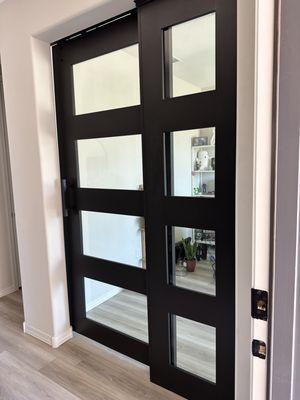 Glass door with stationary door