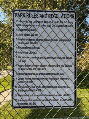 Park rules and regulations posted behind the fence