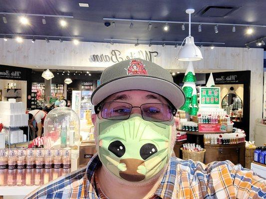 You know, homie is just rocking the baby Yoda mask whilst shopping for candles and stuff!