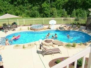 Fire pit, waterfall, spill-over spa with stone waterfall