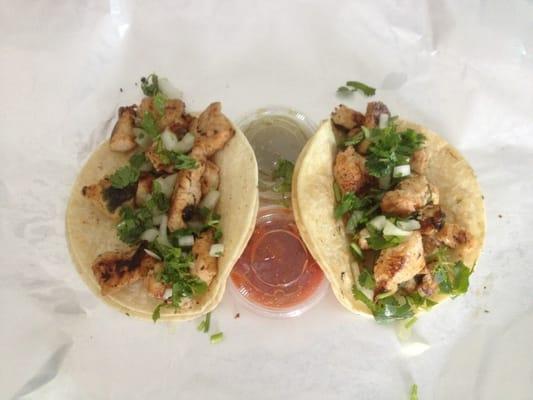 Mexican Street Tacos. Chicken tacos on corn tortillas with onion and cilantro. Fresh made salsa verde