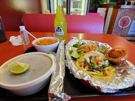 The three tacos combo. Lamb tacos, lamb consume, yellow rice and churro. Yum!!