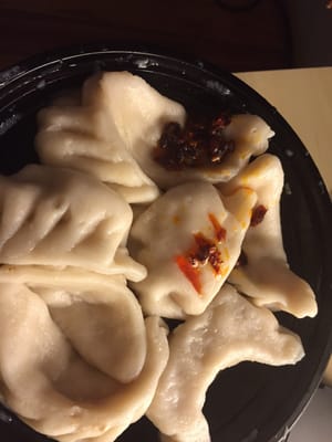 Steamed dumplings w hot oil