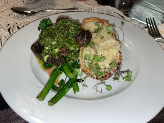 Filet mignon with chimichurri, twice baked potatoes, and broccolini