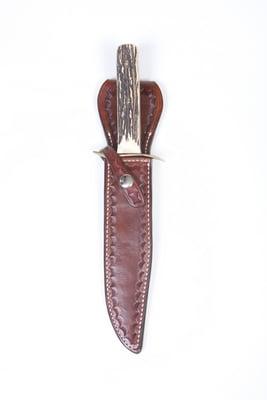 Border tooled knife sheath for Bowie style knife in antique color finish.