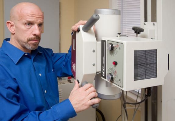 Dr. Connelly preparing to take an x-ray.