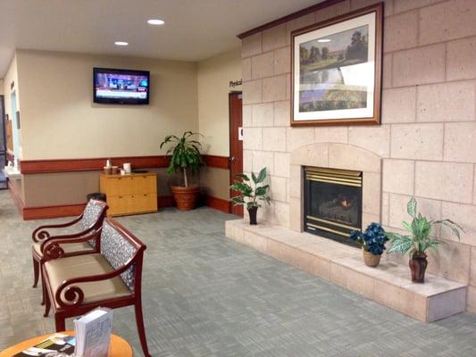 Part of their spacious front lobby with television, fireplace, and free coffee and bottled water.