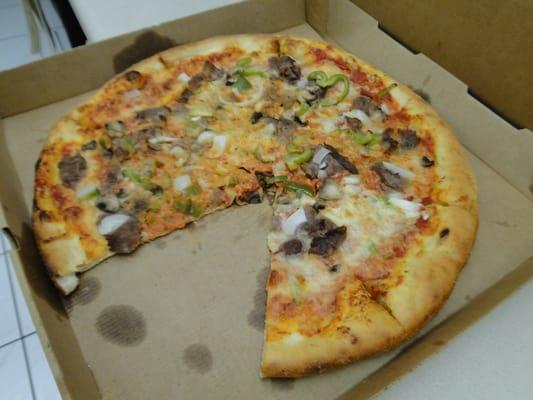 As Yucky tasting as it looks! Philly Steak pizza made w/ red sauce. Crust thin and soggy, scant toppings thrown on Run AWAY, do not eat here