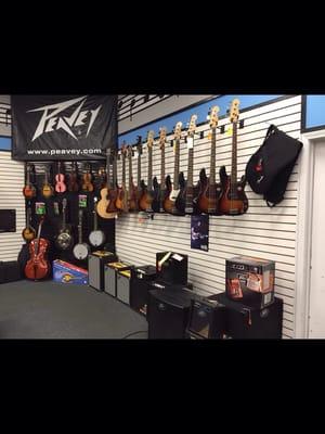 Bass guitars and amps section.