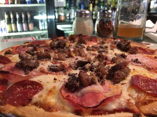 Meat lover's pizza and a wicked stout.