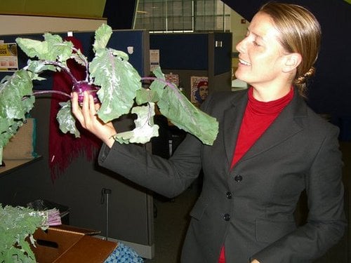 Cara holding kholrabi, one of the veggies we learned how to cook.