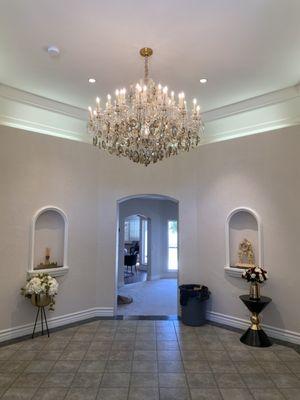 Took a empty entry to a elegant welcoming with a a large 200lbs chandelier.