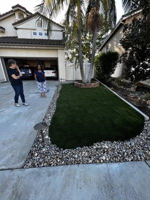 Front yard with rocks and Malibu lights