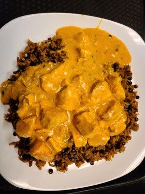 Spicy butter chicken with lentil rice