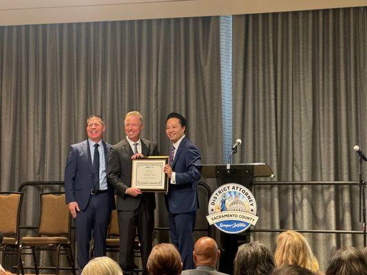 Sacramento DA, Thien Ho and San Joaquin DA, Ron Freitas presented Robert Carichoff with a Community Partnership Award.