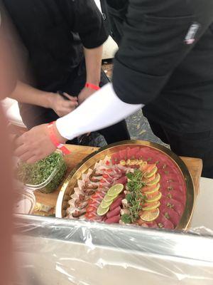 Chefs making sashimi platter during Formula one event 2018