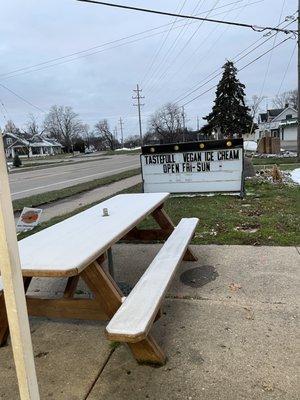 Outdoor seating, sign