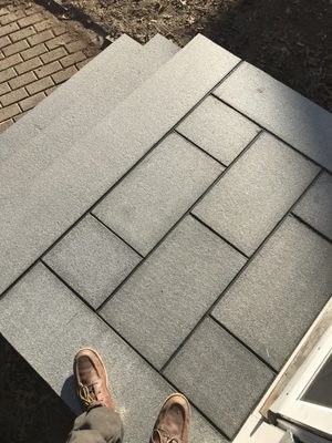 Blue Mist Granite Steps with custom mixed gray mortar joints.