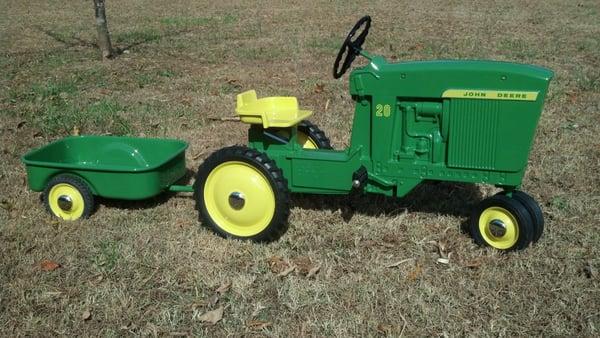 Sometimes the tractors are on the small side. Nice John Deere pedal tractor and trailer.