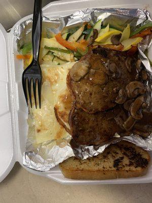 Bacon wrapped meatloaf with mushroom gravy, scalloped potatoes and grilled vegies (with garlic bread-extra)