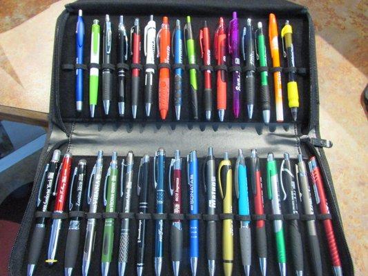 Pens and more pens.  A customer will hold onto a pen longer than your business card.