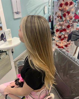 trendy money piece with baby lights throughout the crown and balayage through the ends