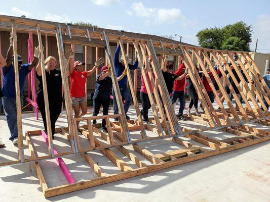 Volunteers building affordable homes supported by the ReStore profits.