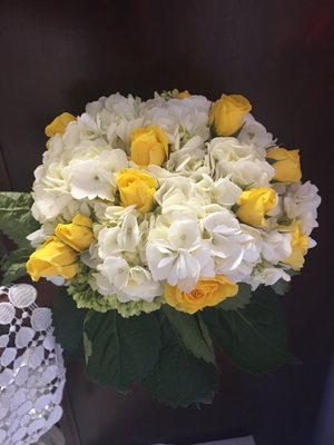 Full bouquet of hydrangeas with a splash of yellow. Maybe not traditional but sure was gorgeous!