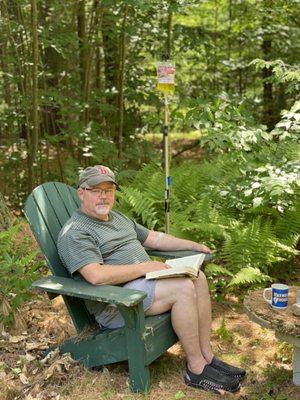 Dr. Adams enjoying his IV infusion while relaxing in his cabin in the woods.