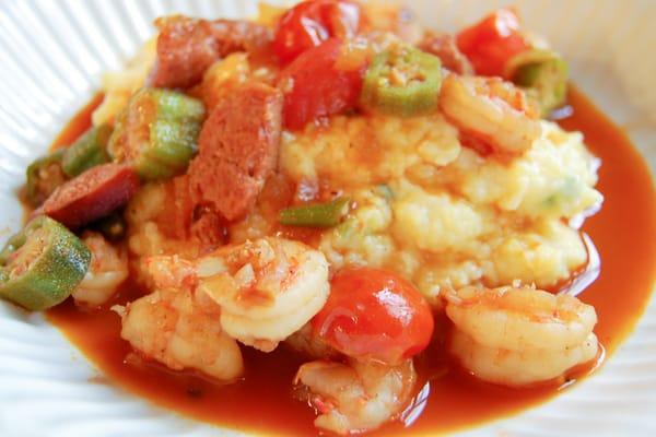 succulent shrimp, chorizo, peppers & okra in tomato broth over cheddar-scallion polenta