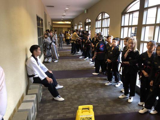 Students getting ready to enter the room for their graduation