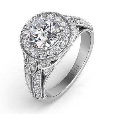 Halo style diamond engagement ring.  See more at www.andrewsjewelers.com